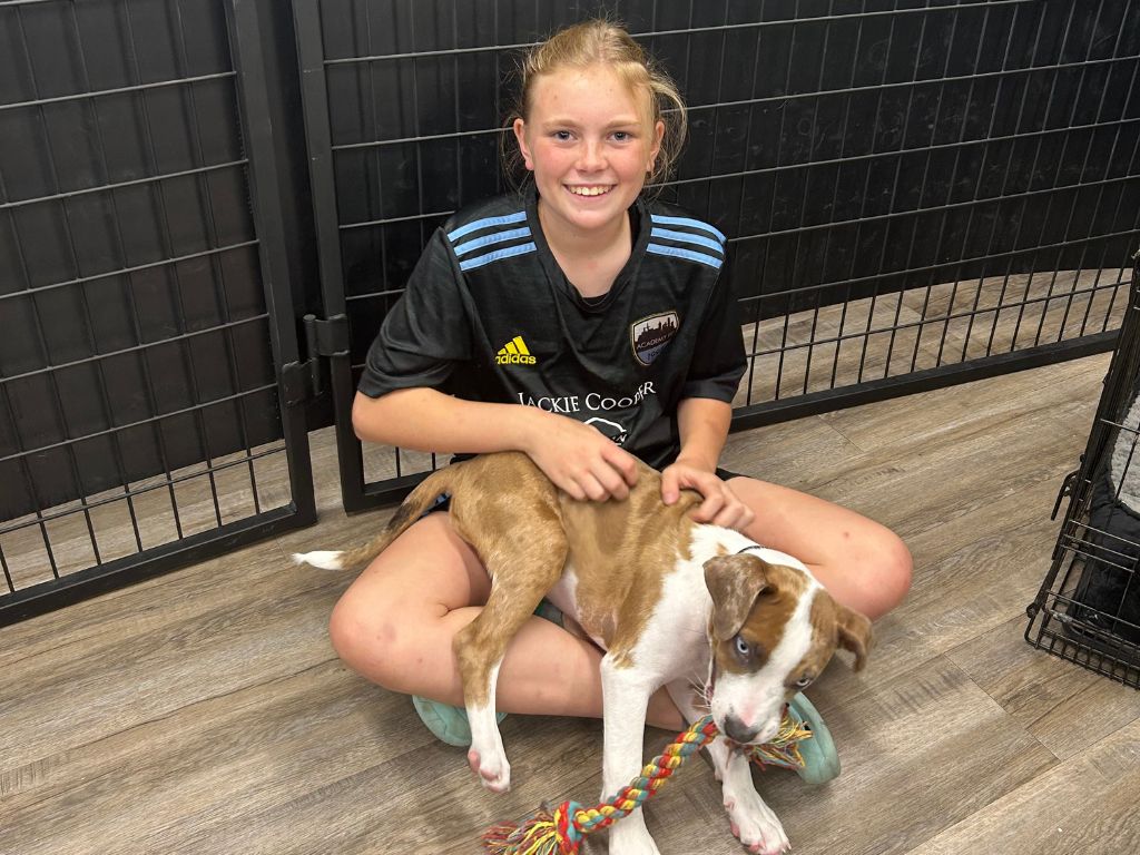 A Day in Your Dog’s Best Days Dog Daycare in Tulsa 6 girl with dog in doggie daycare